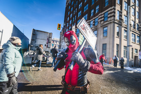 Ottawa, Ontario, Canada - January 29 2022. Protester in Costume of Dreadpool Protesting in the...