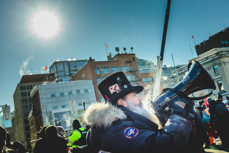 Ottawa, Ontario, Canada - January 29 2022. Protesters in Ottawa Convoy for Freedom 2022 Protesting in the Streets with Megaphoneのeditorial素材