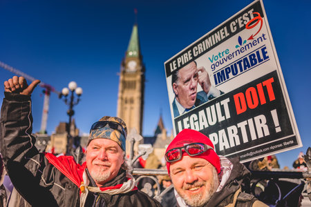 Ottawa, Ontario, Canada - January 29 2022. Protesters in Ottawa Convoy for Freedom 2022 Protesting in the Streets with Legault Signのeditorial素材