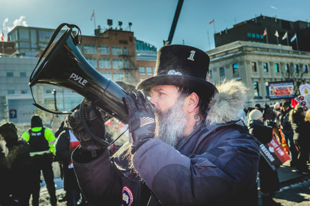Ottawa, Ontario, Canada - January 29 2022. Protesters in Ottawa Convoy for Freedom 2022 Protesting in the Streets with Megaphoneのeditorial素材