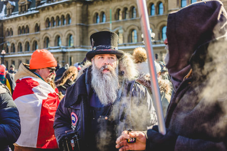 Ottawa, Ontario, Canada - January 29 2022. Protesters in Ottawa Convoy for Freedom 2022 Protesting in the Streets with Megaphoneのeditorial素材