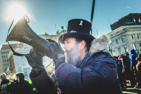 Ottawa, Ontario, Canada - January 29 2022. Protesters in Ottawa Convoy for Freedom 2022 Protesting in the Streets with Megaphoneのeditorial素材