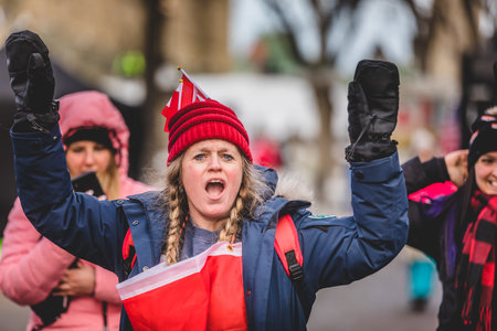 Ottawa, Ontario, Canada - January 30 2022. Protesters in Ottawa Convoy for Freedom 2022 Protesting in the Streets with Flag, Signs and Smiles.のeditorial素材
