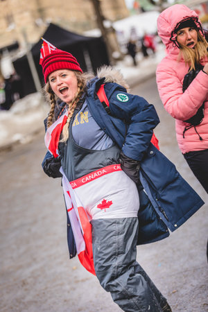 Ottawa, Ontario, Canada - January 30 2022. Protesters in Ottawa Convoy for Freedom 2022 Protesting in the Streets with Flag, Signs and Smiles.のeditorial素材