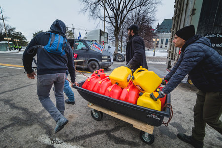 Ottawa, Ontario, Canada - February 11, 2022. People Transportin Diesel Jerry Cans during Freedom Convoy Protest in Ottawa.のeditorial素材