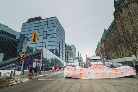 Ottawa, Ontario, Canada - February 11, 2022. Line of Trucks Blocking Wellington Street During Freedom Convoy Protest in Ottawa.のeditorial素材