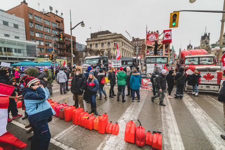 Ottawa, Ontario, Canada - February 11, 2022. Truck and Protesters in Front or Parliament Hill During Freedom Convoy Protest in Ottawa.のeditorial素材