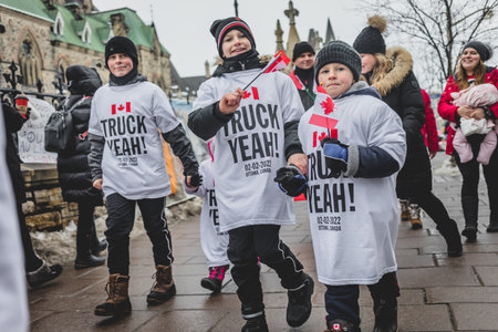 Ottawa, Ontario, Canada - February 11, 2022. Kids wearing Truck Yeah T-Shirts on Wellington Street Front or Parliament Hill During Freedom Convoy Protest in Ottawa.のeditorial素材