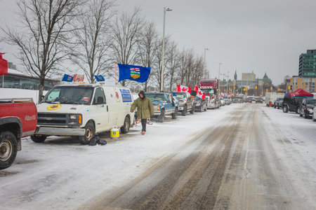 Ottawa, Ontario, Canada - February 12, 2022. Many Trucks and Cars Parked near a Camp for the Freedom Convoy Protest in Ottawa.のeditorial素材