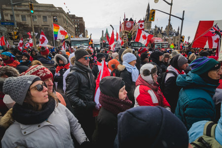 Ottawa, Ontario, Canada - February 12, 2022. Crowd of Protesters in Front of Parliament during Freedom Convoy Protest in Ottawa.のeditorial素材