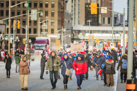 Ottawa, Ontario, Canada - February 12, 2022. Crowd of Protesters in Front of Parliament during Freedom Convoy Protest in Ottawa.のeditorial素材