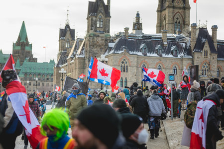 Ottawa, Ontario, Canada - February 12, 2022. Crowd of Protesters in Front of Parliament during Freedom Convoy Protest in Ottawa.のeditorial素材