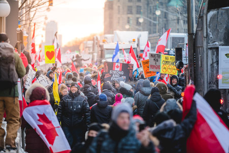 Ottawa, Ontario, Canada - February 12, 2022. Crowd of Protesters in Front of Parliament during Freedom Convoy Protest in Ottawa.のeditorial素材