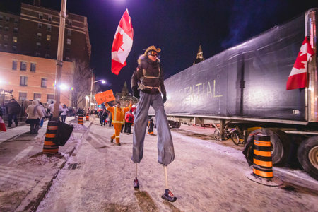 Ottawa, Ontario, Canada - February 12, 2022. Person with long legs during Freedom Convoy Protest in Ottawa.のeditorial素材