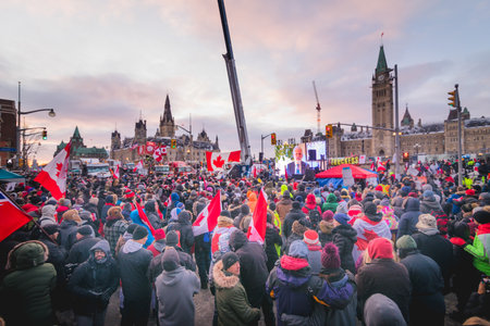 Ottawa, Ontario, Canada - February 12, 2022. Crowd of Protesters in Front of Parliament during Freedom Convoy Protest in Ottawa.のeditorial素材