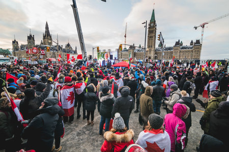 Ottawa, Ontario, Canada - February 12, 2022. Crowd of Protesters in Front of Parliament during Freedom Convoy Protest in Ottawa.のeditorial素材
