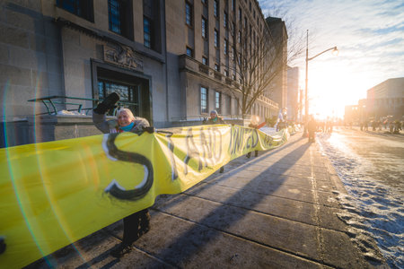 Ottawa, Ontario, Canada - February 13, 2022. Walking Protester with Very Long Message on Wellington Street during Freedom Convoy Protest in Ottawa.のeditorial素材