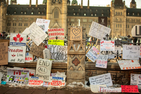 Ottawa, Ontario, Canada - February 13, 2022. Protester Messages on the Fence of the Parliament during Freedom Convoy Protest in Ottawa.のeditorial素材