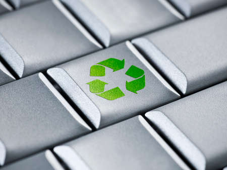 Laptop environmental recycling concept on a computer keybordの写真素材