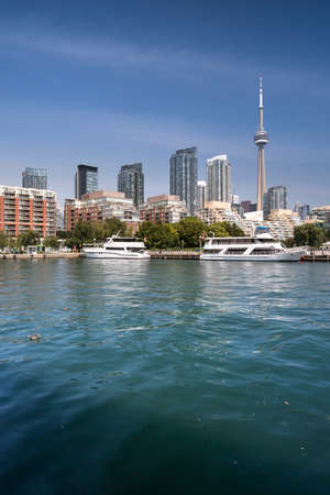 Downtown city view of Toronto Canada from Queens Quay and Lake Ontarioの写真素材