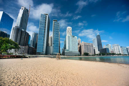 Chicago cityscape across the sand of Ohio Street Beach on Lake Michigan and Lake Shore Drive in Illinois USAの写真素材