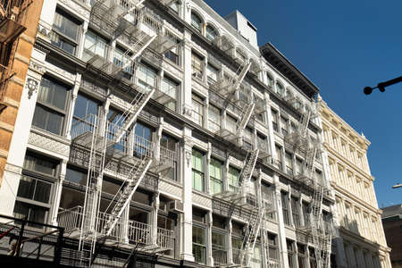 Downtown Manhattan SoHo apartment building details with outdoor fire escapes in downtown Manhattan New York City USAの写真素材