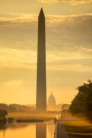 Washington DC Monument and the US Capitol Building across the reflecting pool from the Lincoln Memorial on The National Mall USAの写真素材