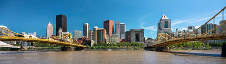 City panoramic skyline view over the Allegheny River and Roberto Clemente Bridge in downtown Pittsburgh Pennsylvania USAの写真素材