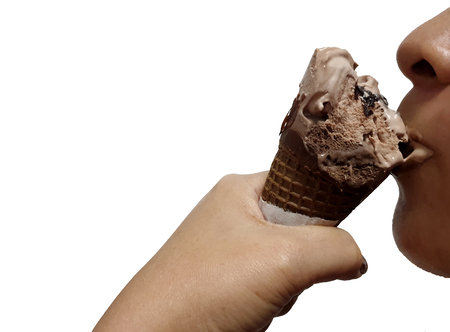 Woman eating chocolate ice cream cone isolated on white background