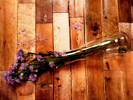 Violet flower vase on wooden backgroundの写真素材