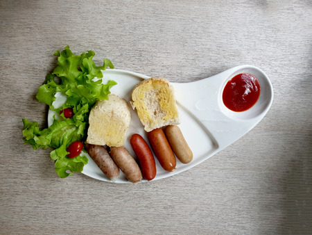 German Sausages with bread and tomato sauceの写真素材