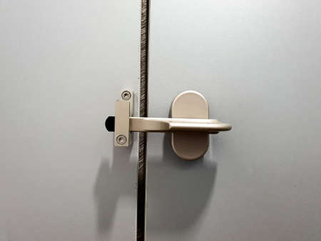 Close up inside door lock in a restroom