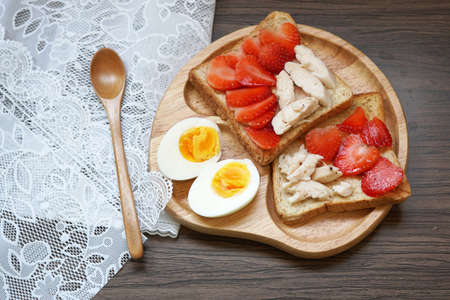 Strawberry and chicken on toast with boil egg for breakfast time.