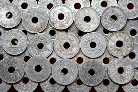 Old thai coin issued 80 year back of Thailand.Siam 1,5,10 satang Rama VIII. coin background.の写真素材