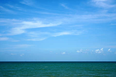 Green sea and blue sky with clouds backgrounds