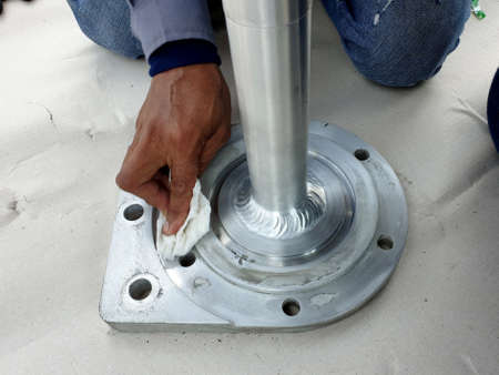 Porcelain bushing of 115 kV Hybrid Switchgear: Electrical supervisor cleaning the point of gas...