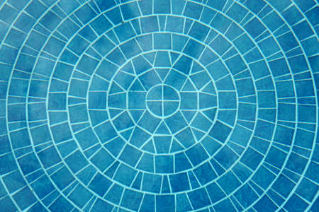 Abstract tile line of the bottom of a swimming pool.