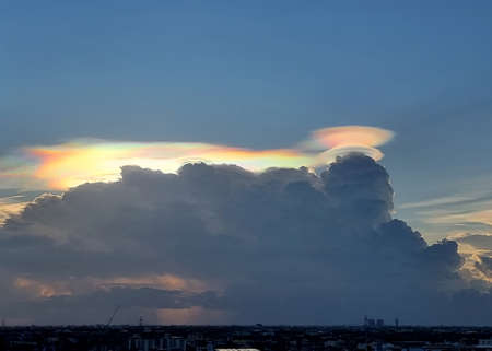 Beautiful light of the sun and cloud in the blue sky over the city.