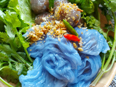Close up Steamed Tapioca Balls filled with Pork Recipe and Steamed rice skin dumplings with green leaf lettuce, coriander and bird pepper.の写真素材