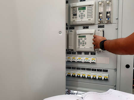 Factory acceptance test (FAT) for electrical control and protection panel: Engineer rechecks all of...