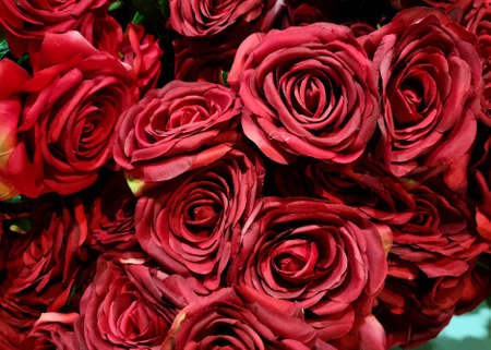 Beautiful red artificial roses in the flower market.の写真素材
