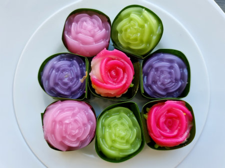 Close-up traditional colorful sweet Thai desserts, Khanom Alua Kularb or Rose shaped sweetmeatsの写真素材