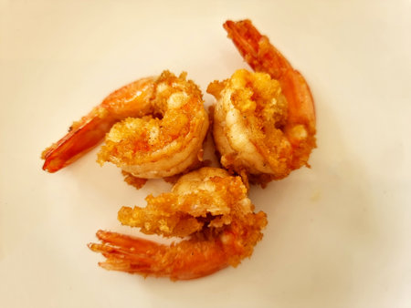 Deep-fried shrimp on a white plate.の写真素材