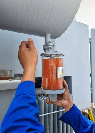 The transformer preventive maintenance, the orange silica gel replacement by electrician.