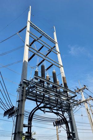The perspective of 115kV Underground Cable Riser Pole in Substation on clouds in the blue sky...