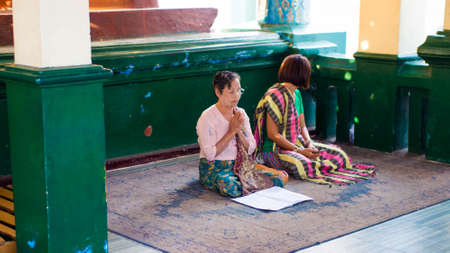 Yangon, Myanmar - February, 15, 2018: Buddhists at Shwedagon Pagodaのeditorial素材