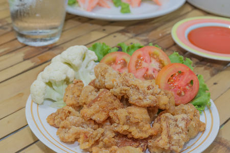 Fried chicken Skin with dip sauce and vegetablesの写真素材