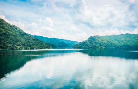 clouds and blue sky with Mountain and Lake of Khundanprakanchon dam, Nakhon Nayok, Thailandの写真素材