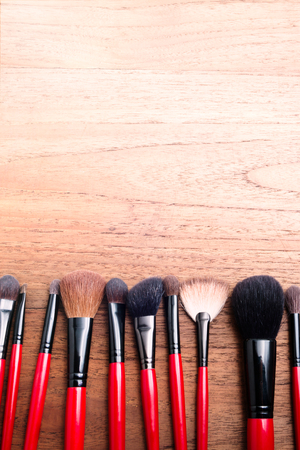 cosmetics makeup brush, on wood table backgroundの写真素材