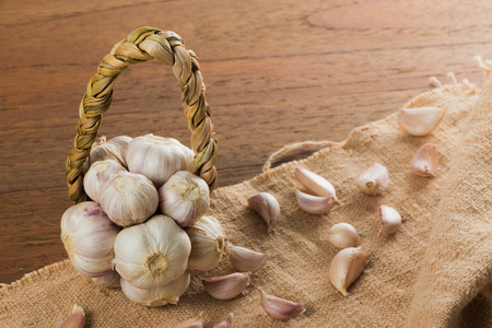 Organic garlic on wood tableの写真素材